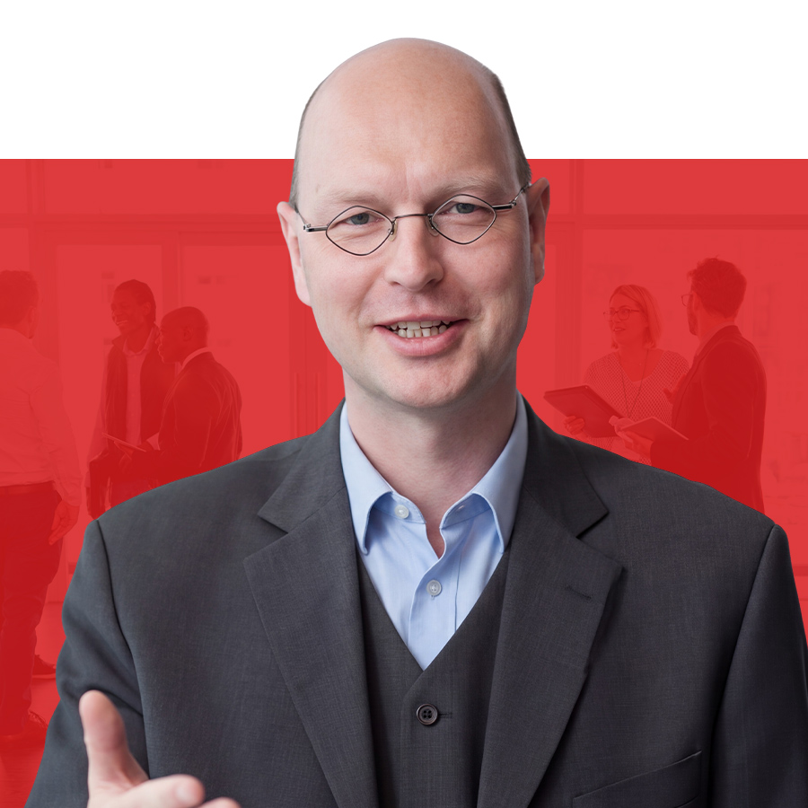 Dr. Michael Risch ADVOS Rechtsanwalt Düsseldorf Dr. Michael Risch Rechtsanwalt bei ADVOS vor rotem Hintergrund